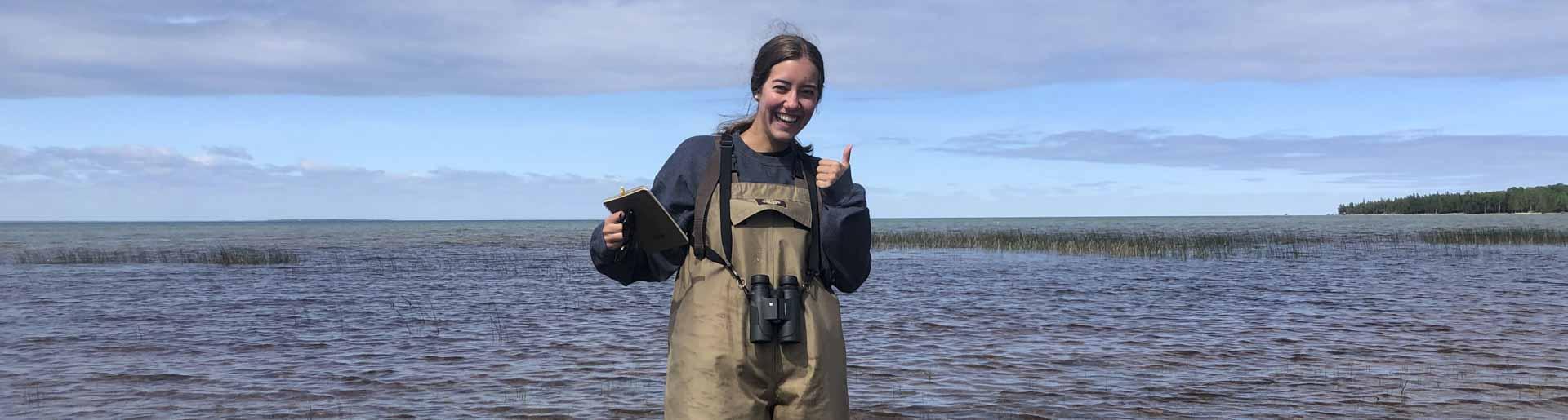 艾比Gosselink conducting research in a river.